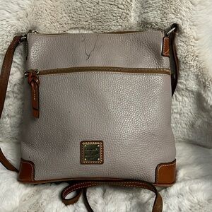 Dooney and Bourke pebbled leather Crossbody shoulder bag(appears lavender)/brown